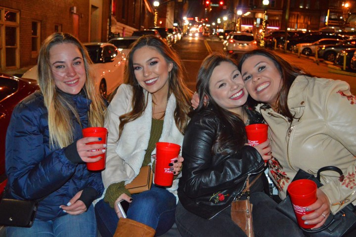 a group of people sitting posing for the camera