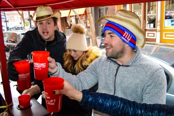 a person holding a hot dog