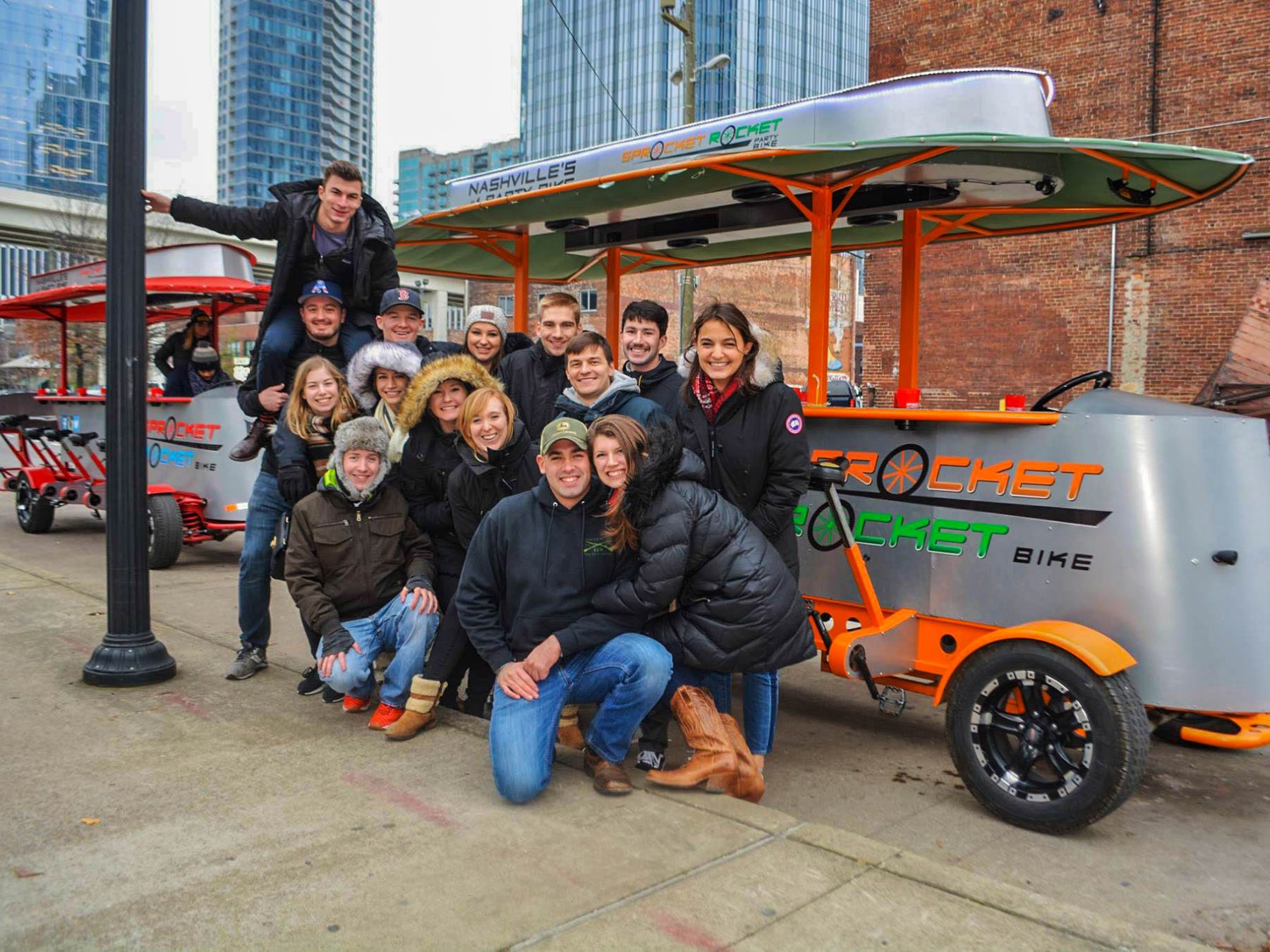 85083215_2602679703287961_3079566786174124032_n a group of people riding on the back of a truck