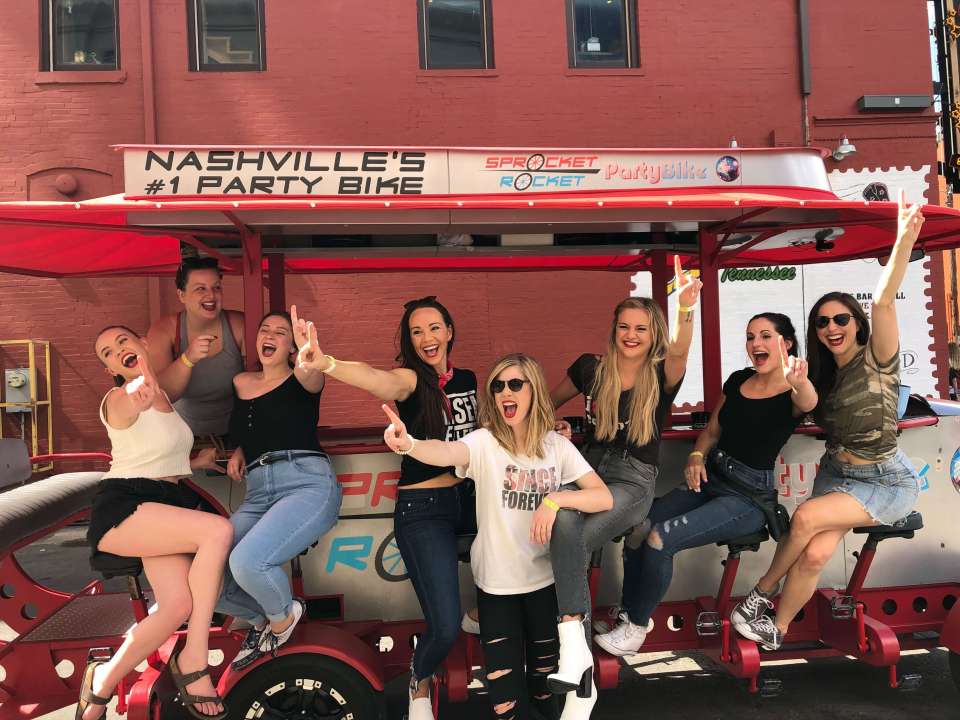 IMG_7244 Kelsea Ballerini et al. sitting in front of a building